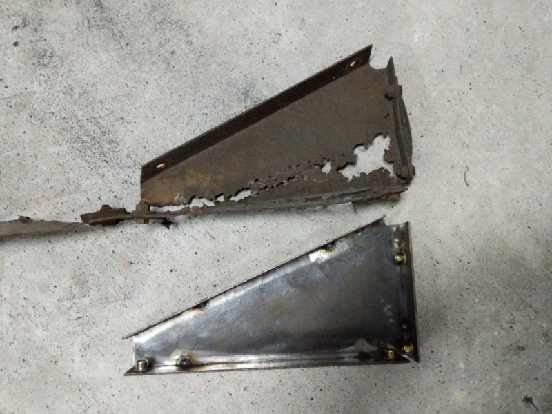 Comparing the original rusted bracket to the new one.