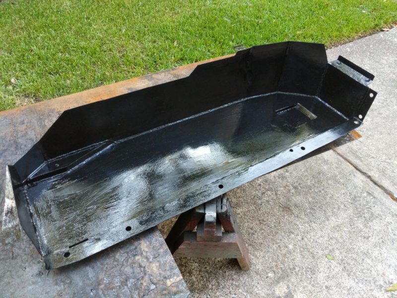 Painted the triangle bracket, skid, and associated brackets in chassis saver to prevent rust.